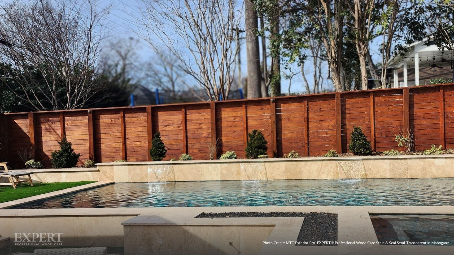 Close-up of fence boards fully saturated with stain