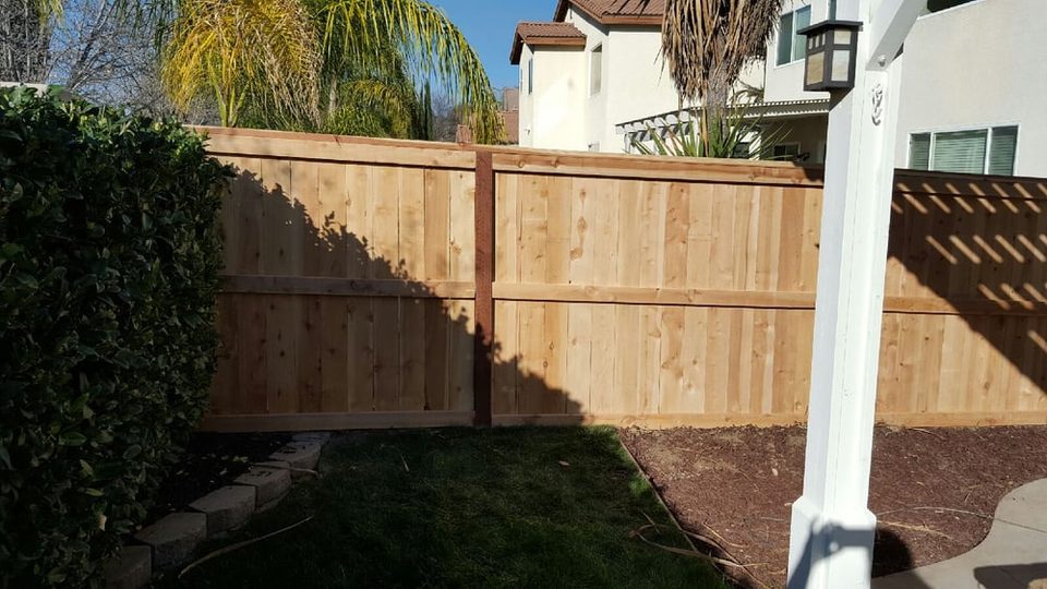 Five-foot wood picture-frame fence with a matching gate